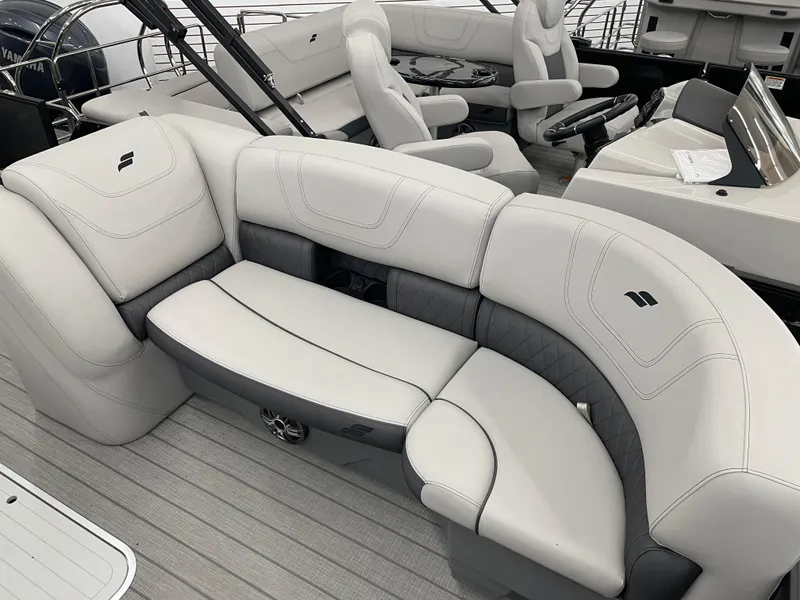 Slide: The Image of 2024 Starcraft SLS 5 boat interior with luxurious white seating and modern design. - 10