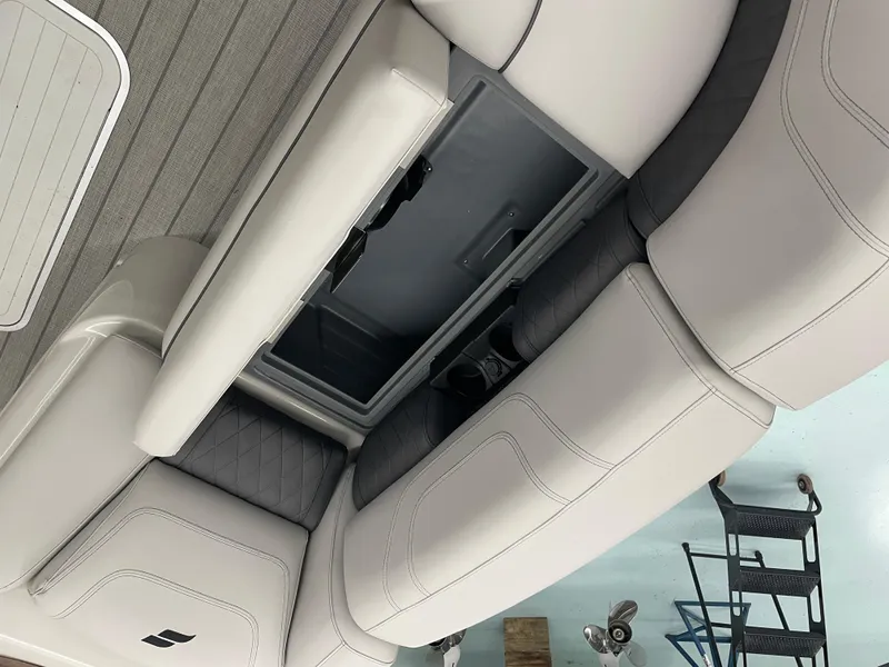 Slide: The Image of 2024 Starcraft SLS 5 boat interior with storage compartment and cushioned seating. - 11