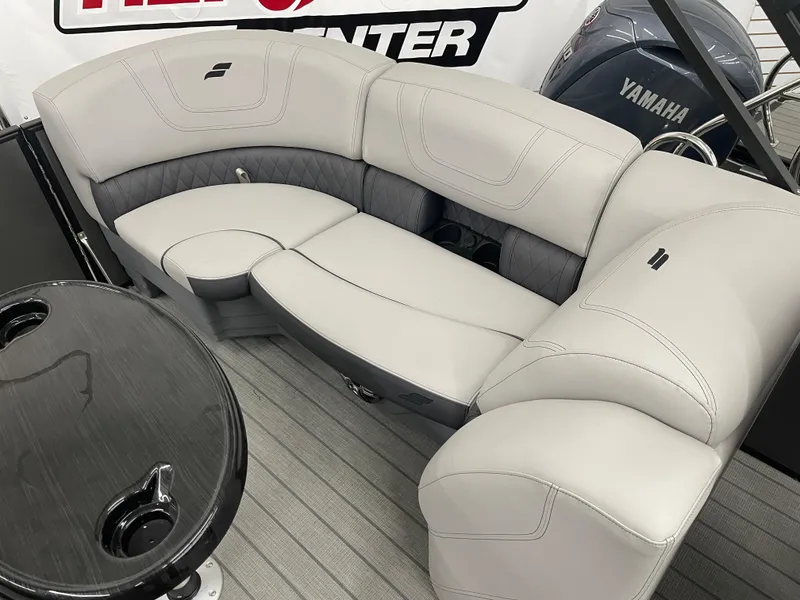 Slide: The Image of 2024 Starcraft SLS 5 boat interior with gray seating and Yamaha motor. - 19