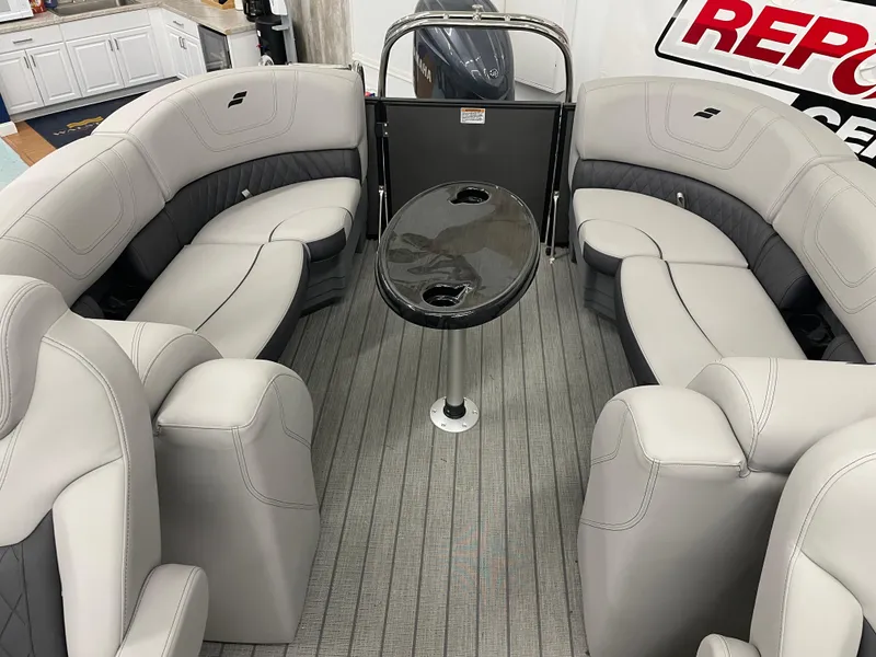 Slide: The Image of 2024 Starcraft SLS 5 boat interior with plush seating and sleek table design. - 20