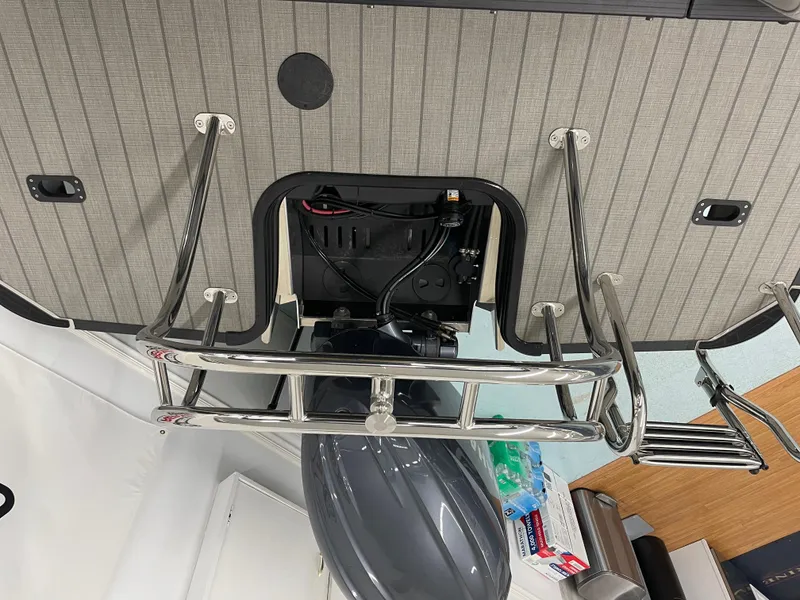 Slide: The Image of 2024 Starcraft SLS 5 boat motor and ladder detail, showcasing sleek design and functionality. - 21