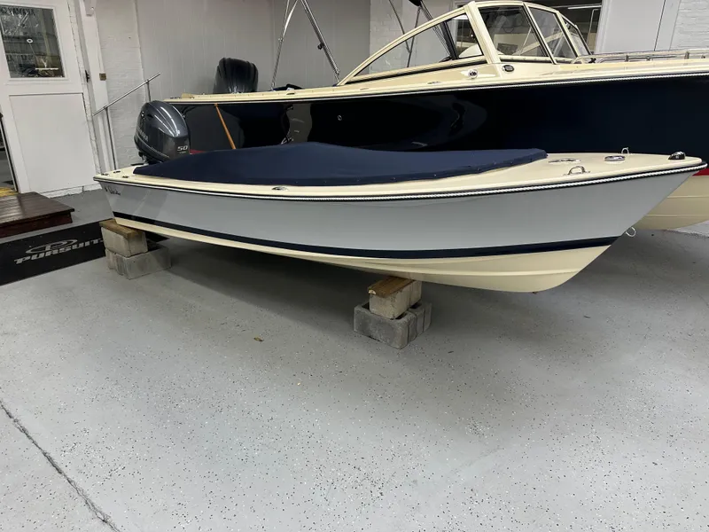 Slide: The Image of 2025 Rossiter 14 boat displayed indoors on blocks. - 3