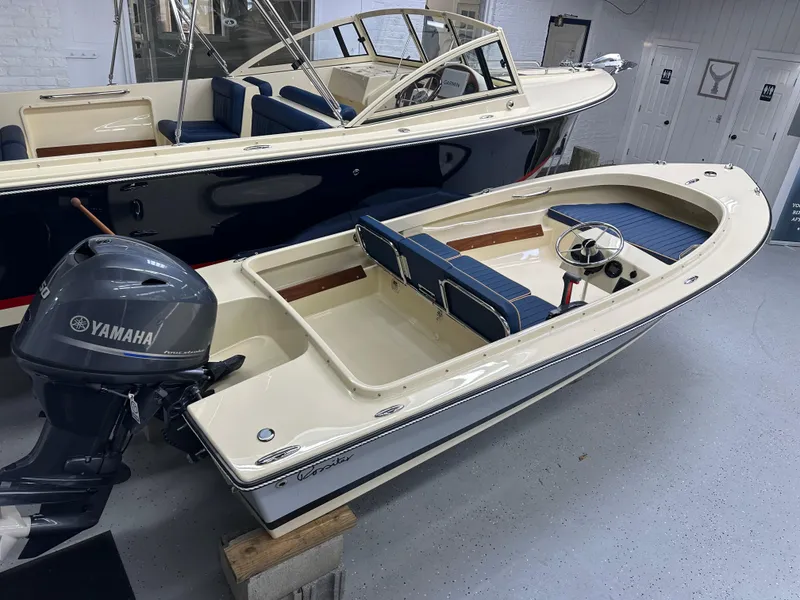 Slide: The Image of 2025 Rossiter 14 boat with Yamaha outboard motor in showroom. - 5