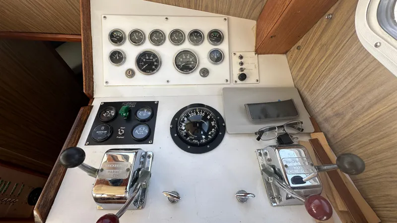 Slide: The Image of 1972 Bristol 42 Offshore Trawler control panel with gauges and compass. - 12
