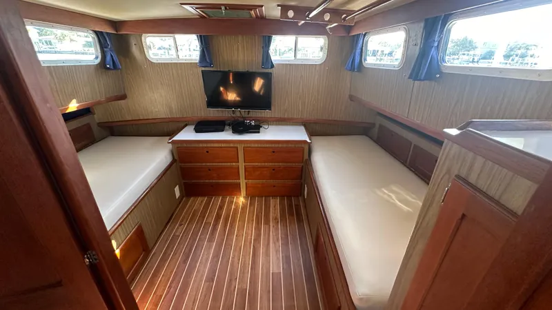 Slide: The Image of Interior of 1972 Bristol 42 Offshore Trawler with twin beds and wood paneling. - 13