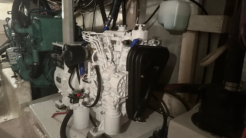 Slide: The Image of Engine room of 1972 Bristol 42 Offshore Trawler, showcasing mechanical components and wiring. - 24