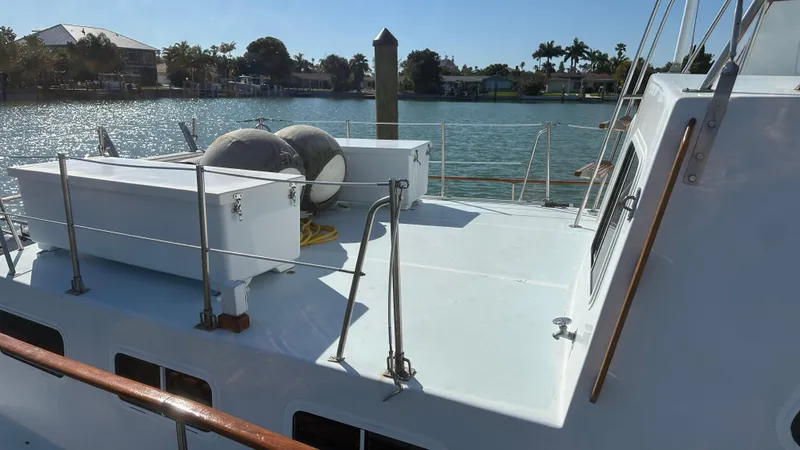 Slide: The Image of 1972 Bristol 42 Offshore Trawler deck with scenic waterfront view. - 33