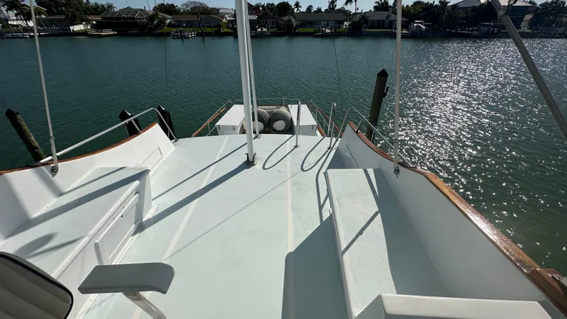 Slide: The Image of 1972 Bristol 42 Offshore Trawler deck overlooking serene waterfront. - 35