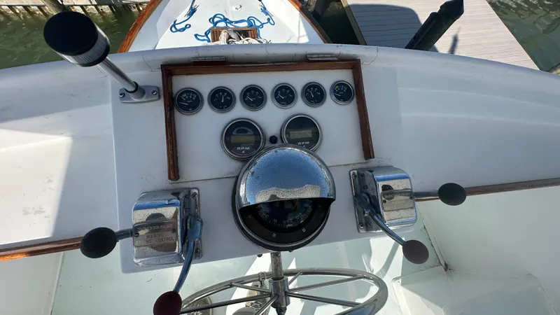 Slide: The Image of 1972 Bristol 42 Offshore Trawler helm with gauges and controls. - 36