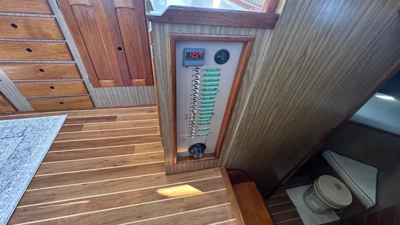 Slide: The Image of Interior of 1972 Bristol 42 Offshore Trawler with control panel and wooden flooring. - 9