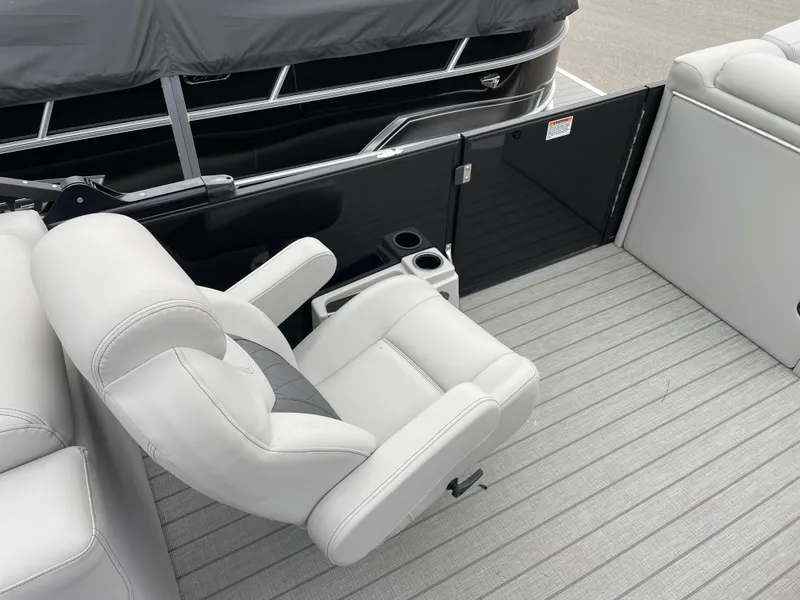 Slide: The Image of 2024 Starcraft SLS 5 boat interior with white seating and cup holders. - 12