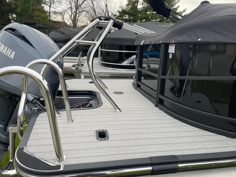 Slide: The Image of 2024 Starcraft SLS 5 pontoon boat with Yamaha engine, featuring sleek deck design. - 5