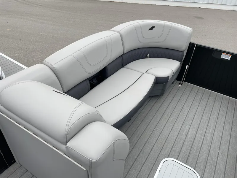 Slide: The Image of 2024 Starcraft SLS 5 boat interior with gray seating and flooring. - 6
