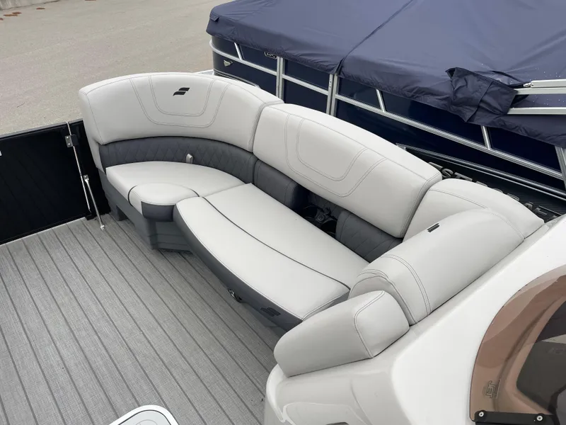 Slide: The Image of 2024 Starcraft SLS 5 boat with luxurious gray seating and sleek design. - 7