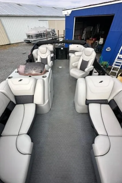 Slide: The Image of 2021 Starcraft SLS 1 boat interior with plush seating and modern design. - 2