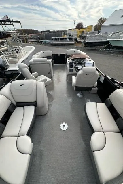 Slide: The Image of 2021 Starcraft SLS 1 pontoon boat with spacious seating and modern design. - 4