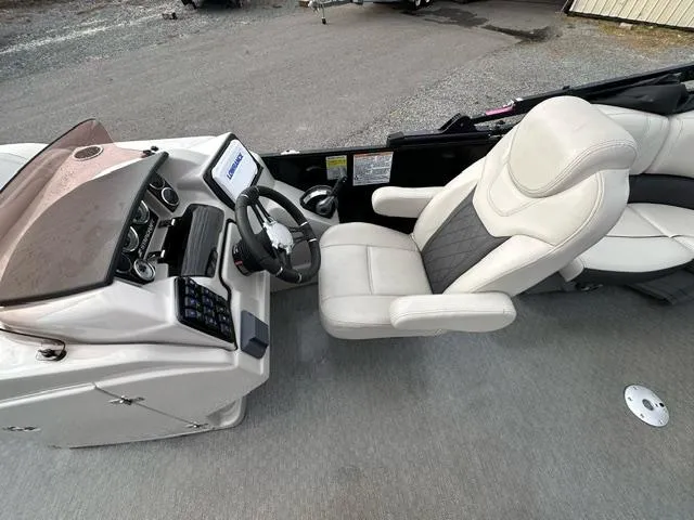 Slide: The Image of 2021 Starcraft SLS 1 boat interior with steering console and comfortable seating. - 5