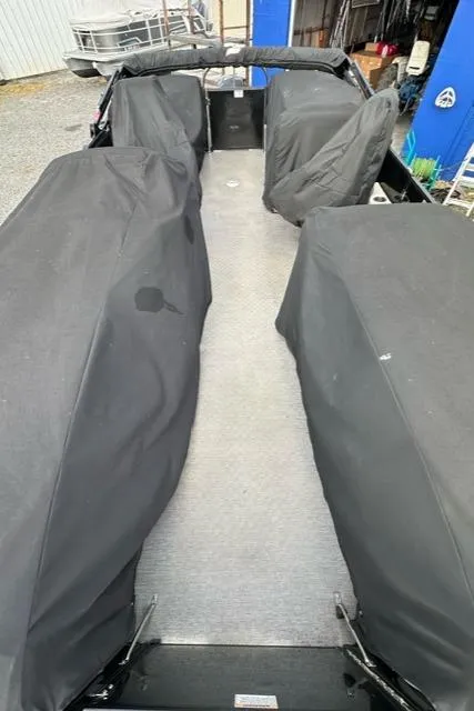 Slide: The Image of 2021 Starcraft SLS 1 boat interior with covered seating and carpeted floor. - 7