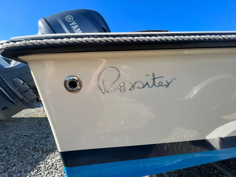 Slide: The Image of Rossiter Shoreline 14 boat, 2016 model, with Yamaha engine, on gravel surface. - 19