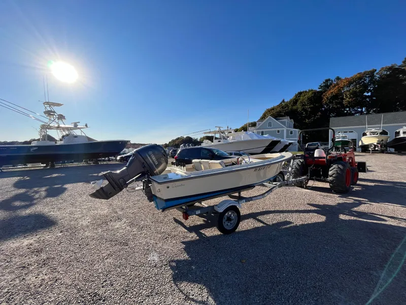 Slide: The Image of 2016 Rossiter Shoreline 14 boat on trailer in sunny marina. - 3