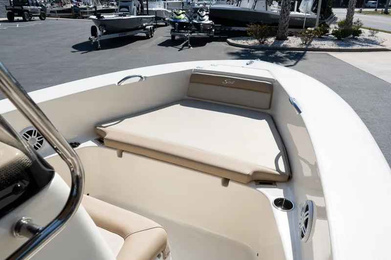 Slide: The Image of 2025 Scout 195 Sportfish boat interior with beige seating and modern design. - 16