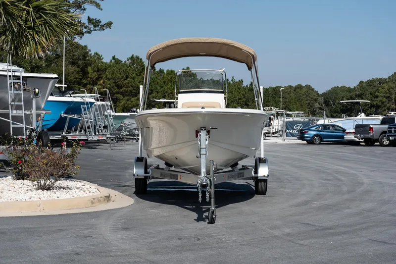 Slide: The Image of 2025 Scout 195 Sportfish boat on trailer in parking lot. - 3