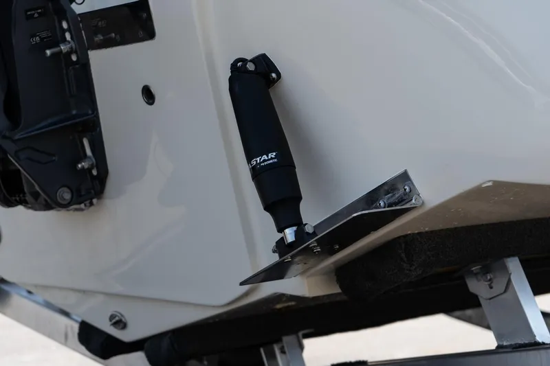 Slide: The Image of 2025 Scout 195 Sportfish boat detail, featuring trim tab and hydraulic system. - 5