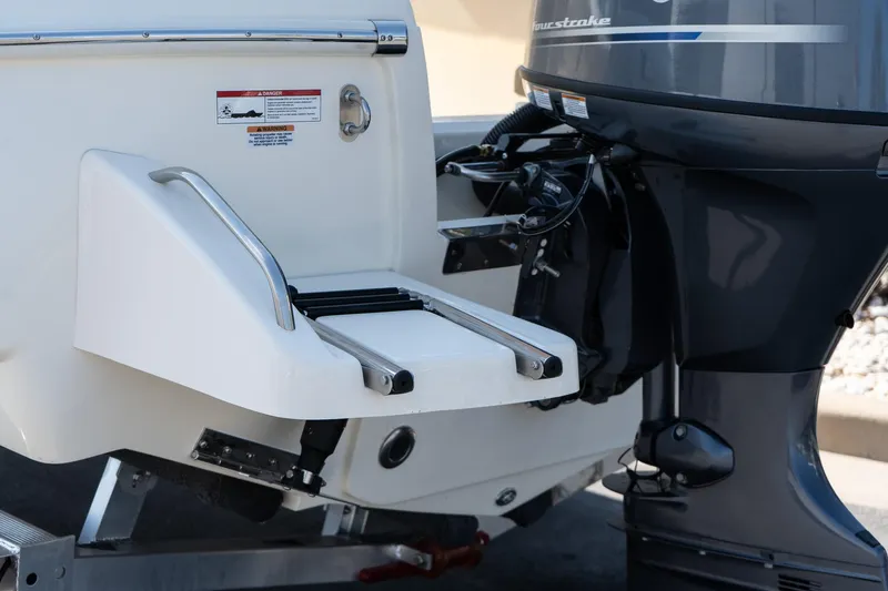 Slide: The Image of 2025 Scout 195 Sportfish boat with outboard motor and swim platform. - 6