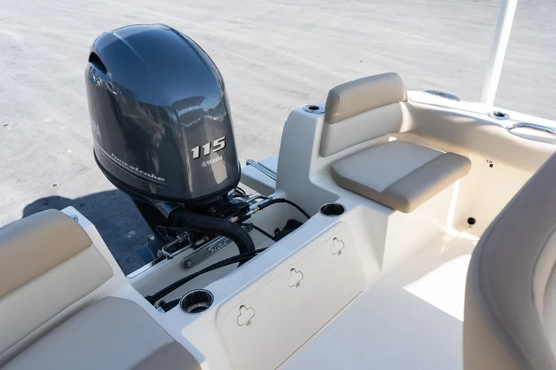 Slide: The Image of 2025 Scout 195 Sportfish boat with Yamaha 115 outboard motor and seating. - 8
