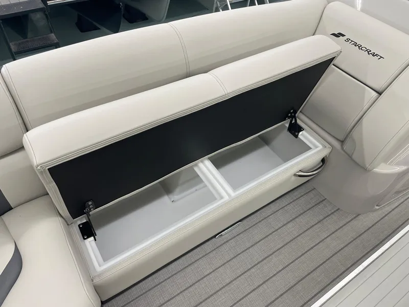 Slide: The Image of Starcraft RX 25 Q DC 2025 boat seat with open storage compartment. - 10