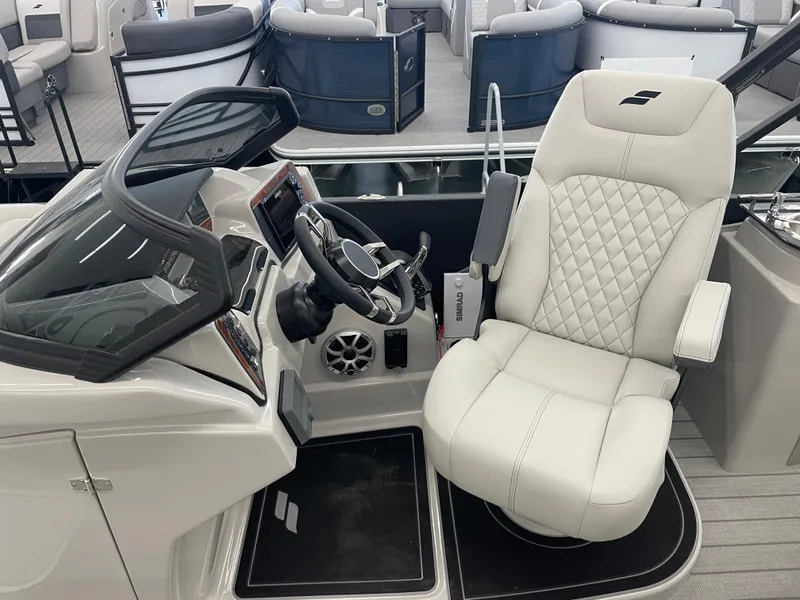 Slide: The Image of Luxurious helm seat of 2025 Starcraft RX 25 Q DC boat with modern dashboard. - 12