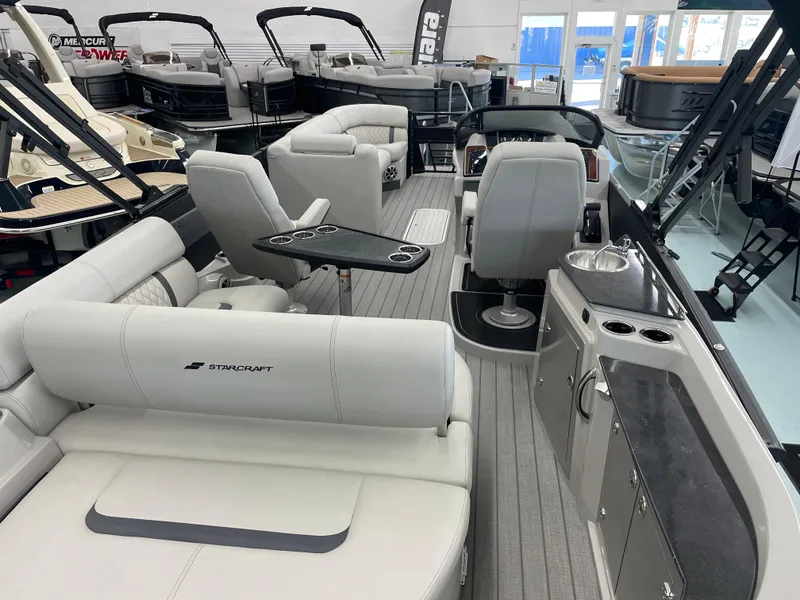 Slide: The Image of 2025 Starcraft RX 25 Q DC boat interior with luxurious seating and modern amenities. - 20