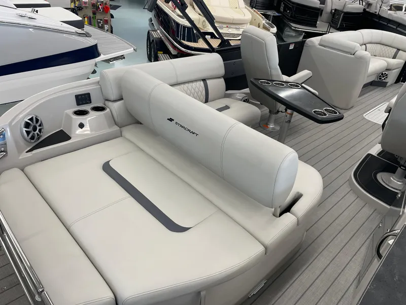 Slide: The Image of Luxurious interior of 2025 Starcraft RX 25 Q DC boat with plush seating and modern amenities. - 21