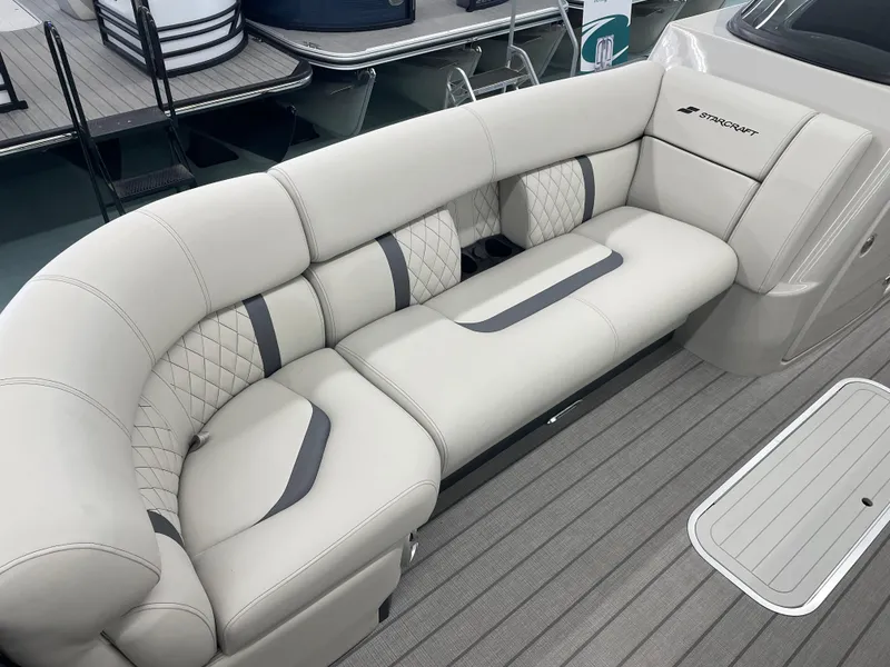 Slide: The Image of Luxurious seating on 2025 Starcraft RX 25 Q DC boat, featuring elegant upholstery and modern design. - 8