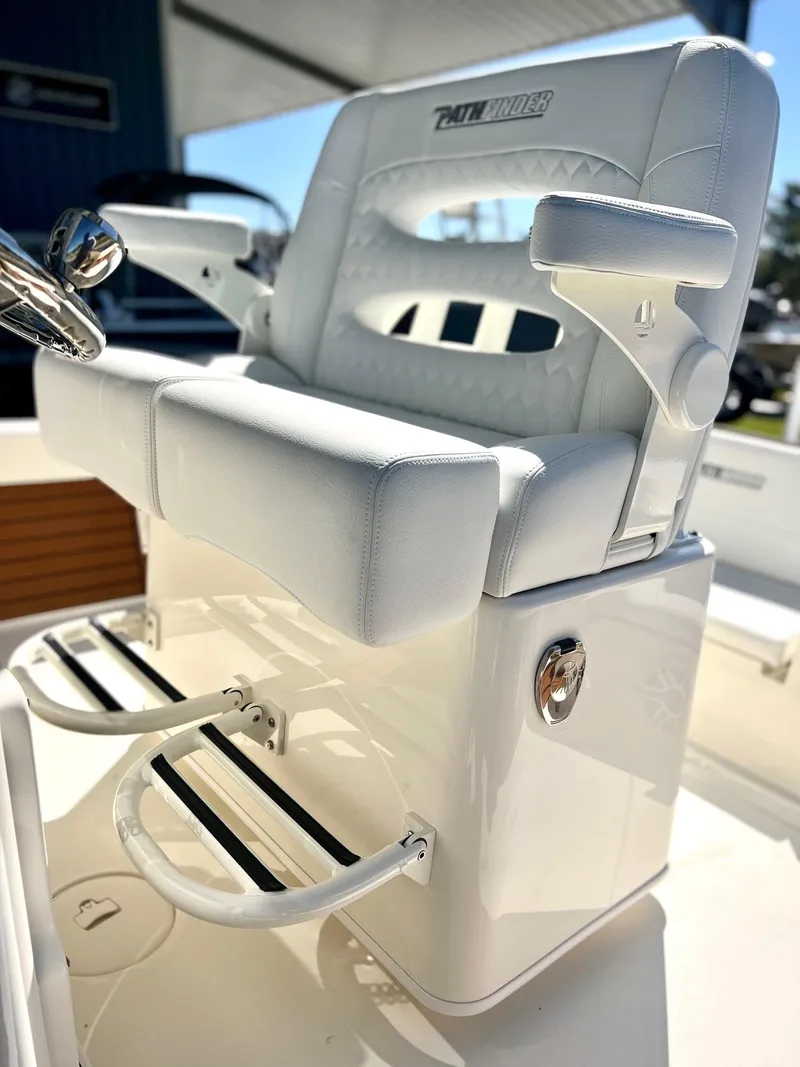 Slide: The Image of 2025 Pathfinder 2600 TRS boat seat with armrests and footrest, white upholstery. - 4