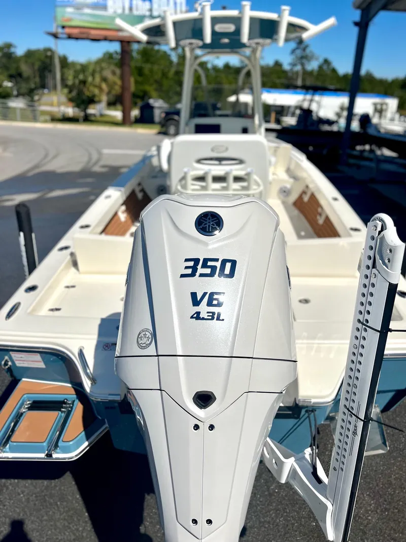 Slide: The Image of 2025 Pathfinder 2600 TRS boat with 350 V6 engine, outdoor display. - 8