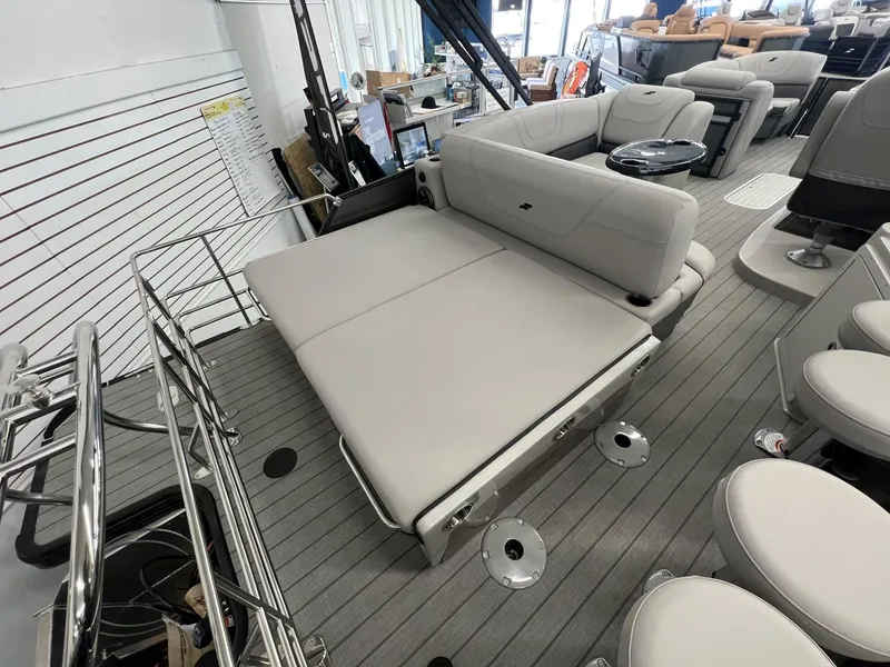 Slide: The Image of 2023 Starcraft CX 25 DL BAR boat interior with gray seating and modern design. - 16