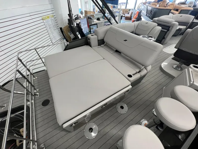 Slide: The Image of 2023 Starcraft CX 25 DL BAR boat interior with gray seating and modern design. - 17