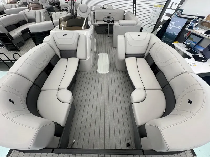 Slide: The Image of 2023 Starcraft CX 25 DL BAR pontoon boat interior with luxurious seating and modern design. - 4