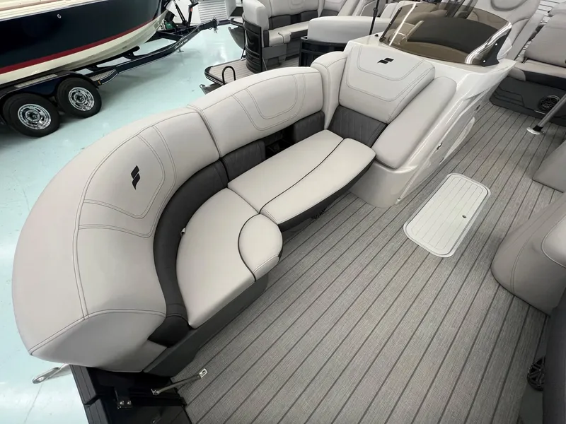 Slide: The Image of 2023 Starcraft CX 25 DL BAR boat interior with plush seating and sleek design. - 5