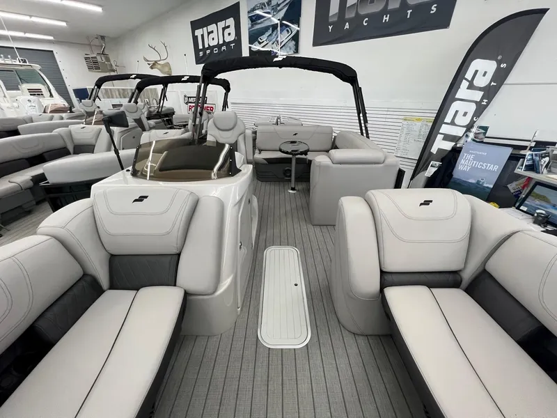 Slide: The Image of 2023 Starcraft CX 25 DL BAR pontoon boat interior with luxurious seating and modern design. - 7