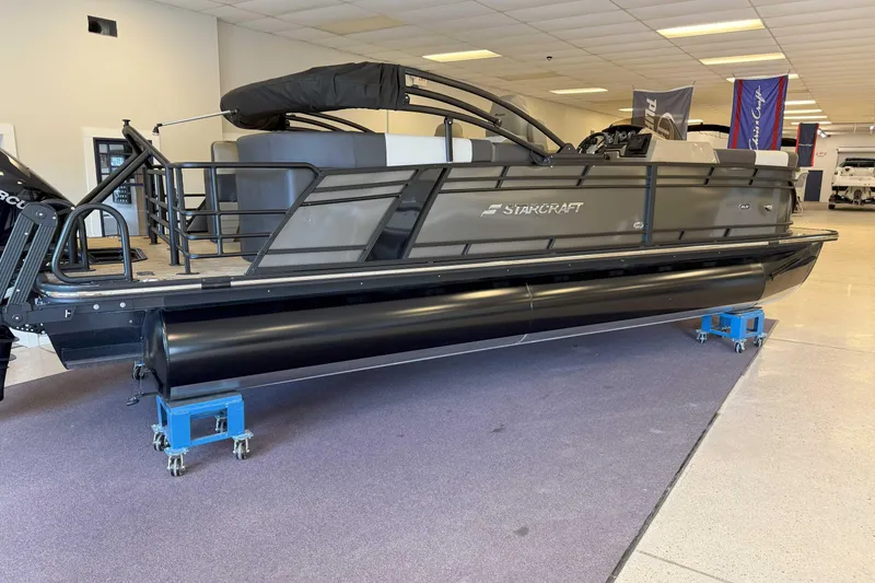 The Image of 2024 Starcraft SLS 3 pontoon boat displayed indoors, featuring sleek design and modern amenities. - 0