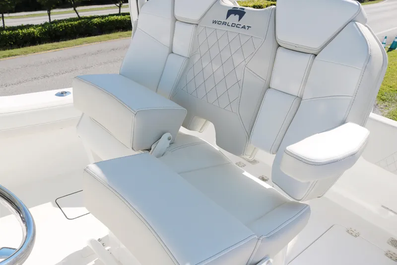 Slide: The Image of 2025 World Cat 260 CC-X boat seating with white upholstery and diamond stitching. - 7