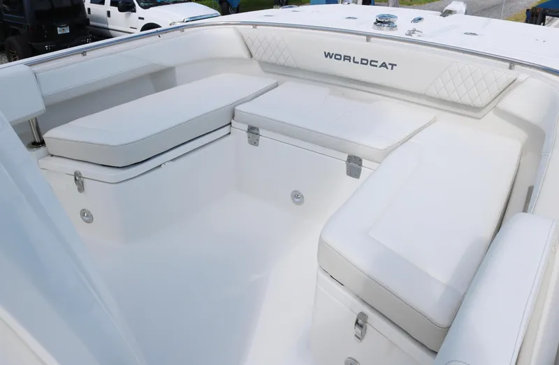 Slide: The Image of 2025 World Cat 260 CC-X boat interior with white cushioned seating. - 8