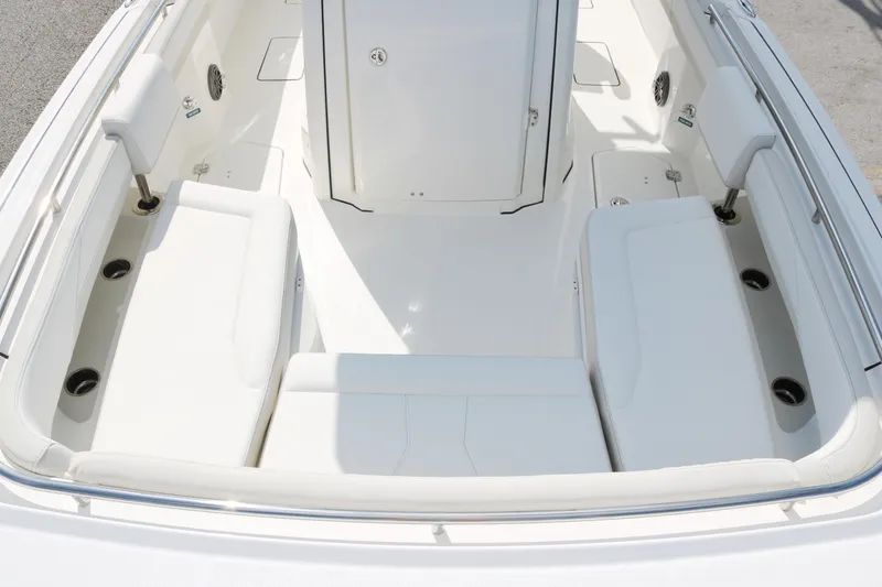 Slide: The Image of 2025 World Cat 260 CC-X boat interior with white seating and storage compartments. - 9