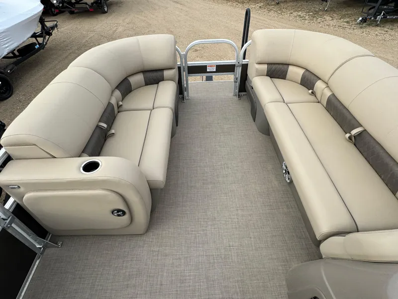 Slide: The Image of 2023 Sun Tracker SportFish 22 DLX pontoon boat with beige seating and spacious deck. - 20