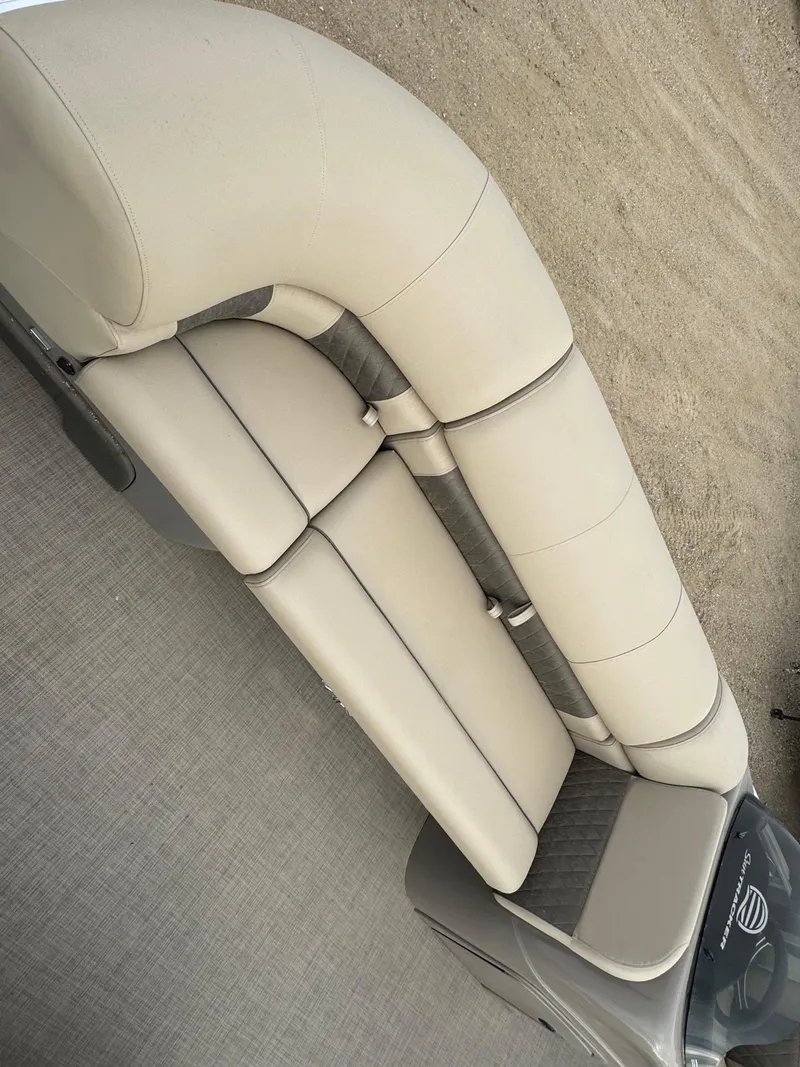 Slide: The Image of 2023 Sun Tracker SportFish 22 DLX boat seating, beige upholstery, top view. - 5