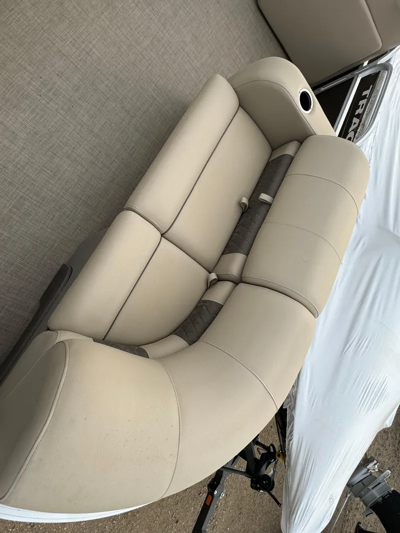 Slide: The Image of 2023 Sun Tracker SportFish 22 DLX boat seating, beige upholstery, top view. - 6