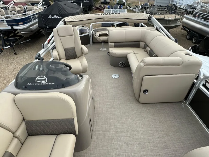 Slide: The Image of 2023 Sun Tracker SportFish 22 DLX pontoon boat with spacious seating and modern design. - 7
