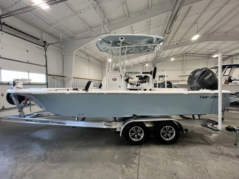 The Image of 2025 Tidewater 2300 Carolina Bay boat in a showroom on a trailer. - 1